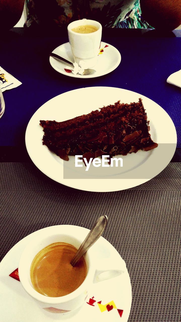 CLOSE-UP OF CAKE WITH COFFEE