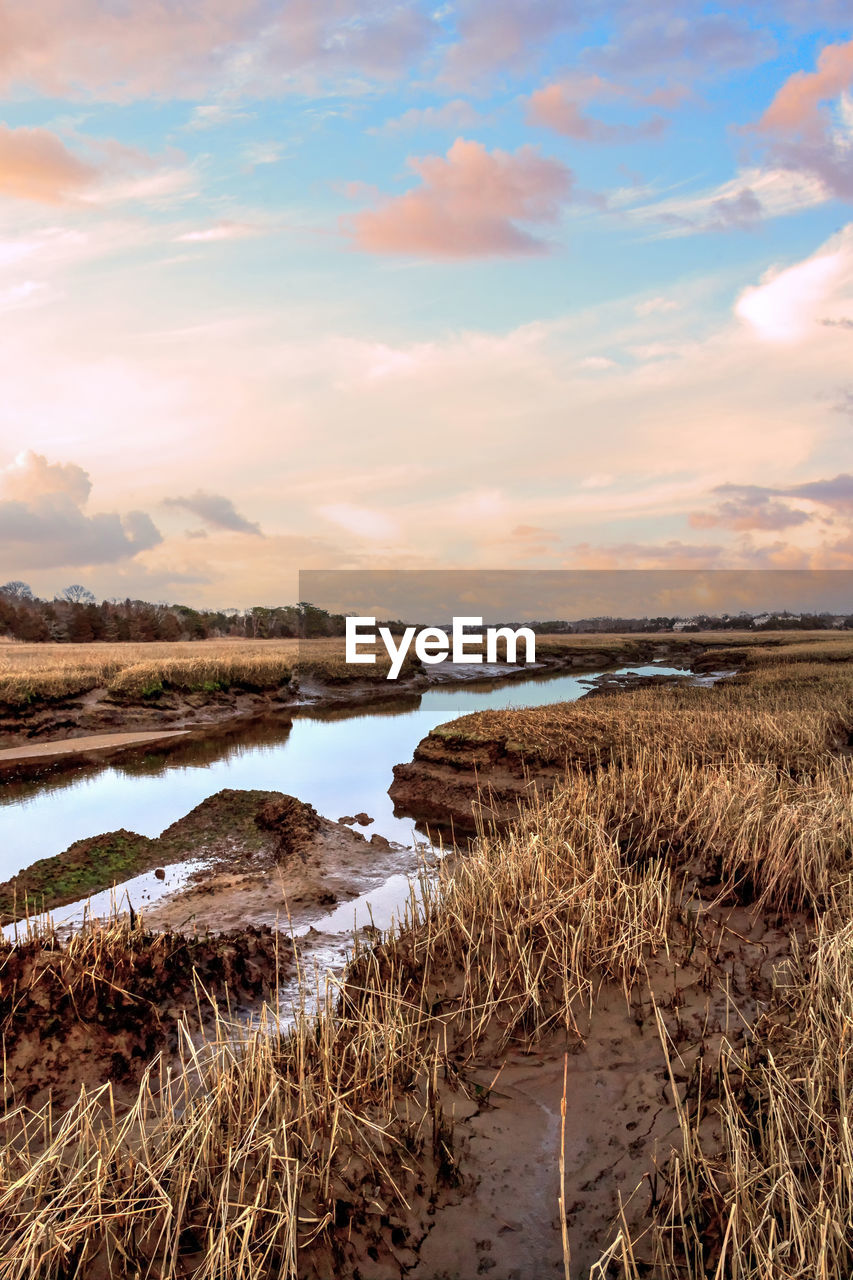 Sunset sky over the marsh and sesuit creek in east dennis in winter