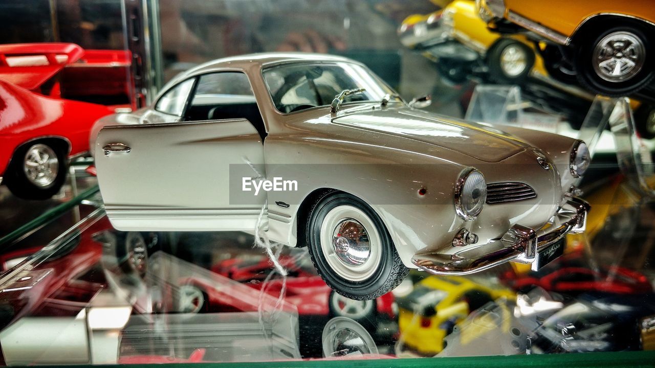 CLOSE-UP OF VINTAGE CAR ON MOTORCYCLE