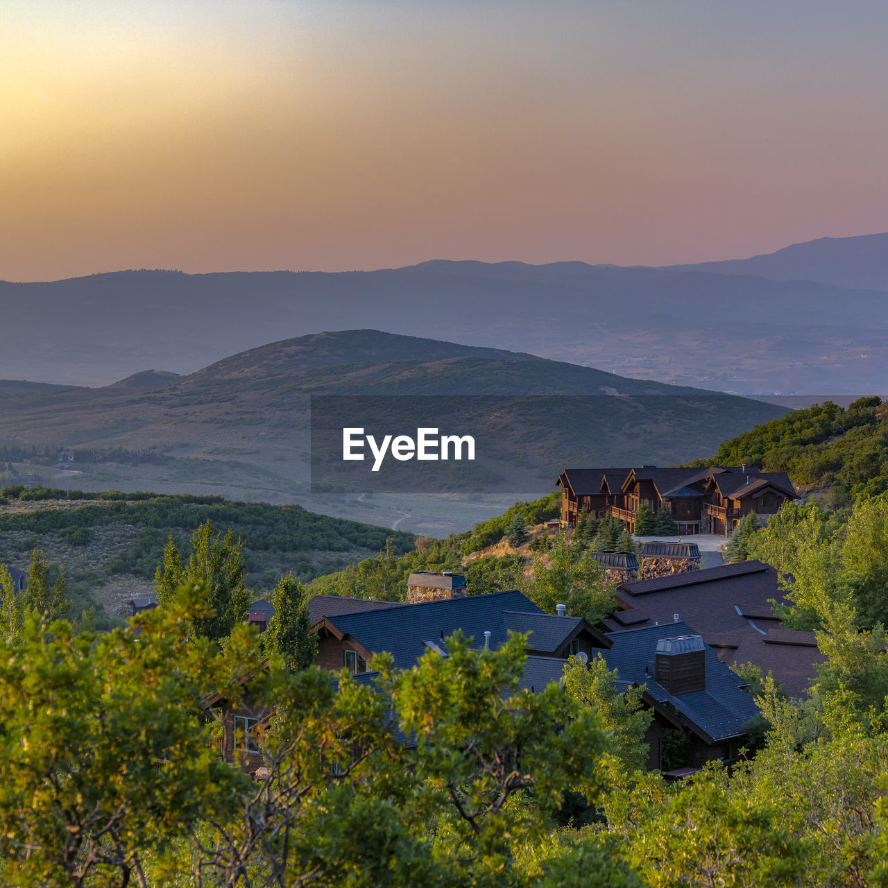 SCENIC VIEW OF MOUNTAINS AGAINST SKY DURING SUNSET