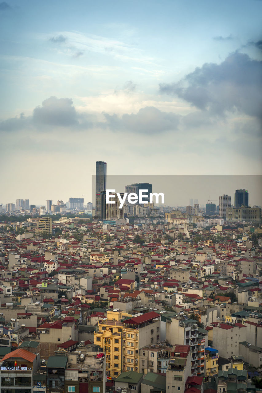 High angle view of buildings in city against sky