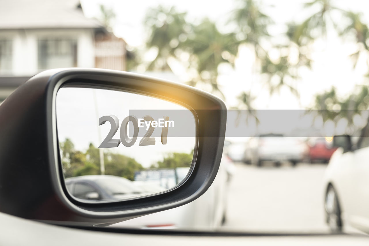 REFLECTION OF SIDE-VIEW MIRROR OF CAR