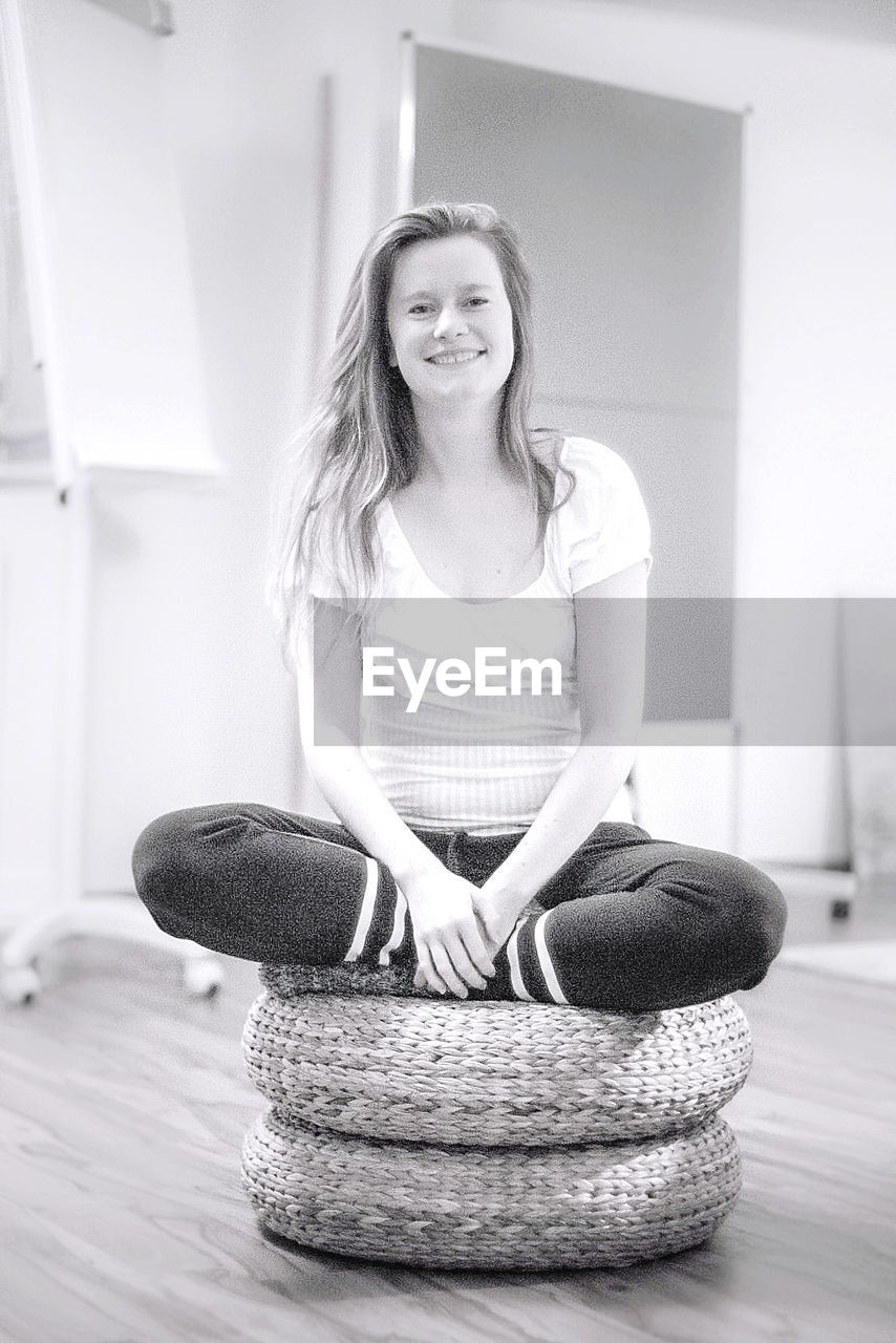 PORTRAIT OF A GIRL SMILING AT HOME