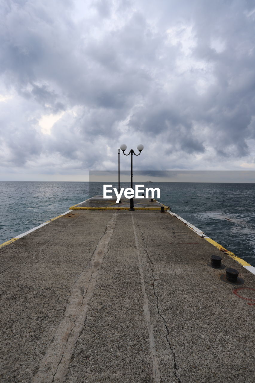 Pier over sea against sky