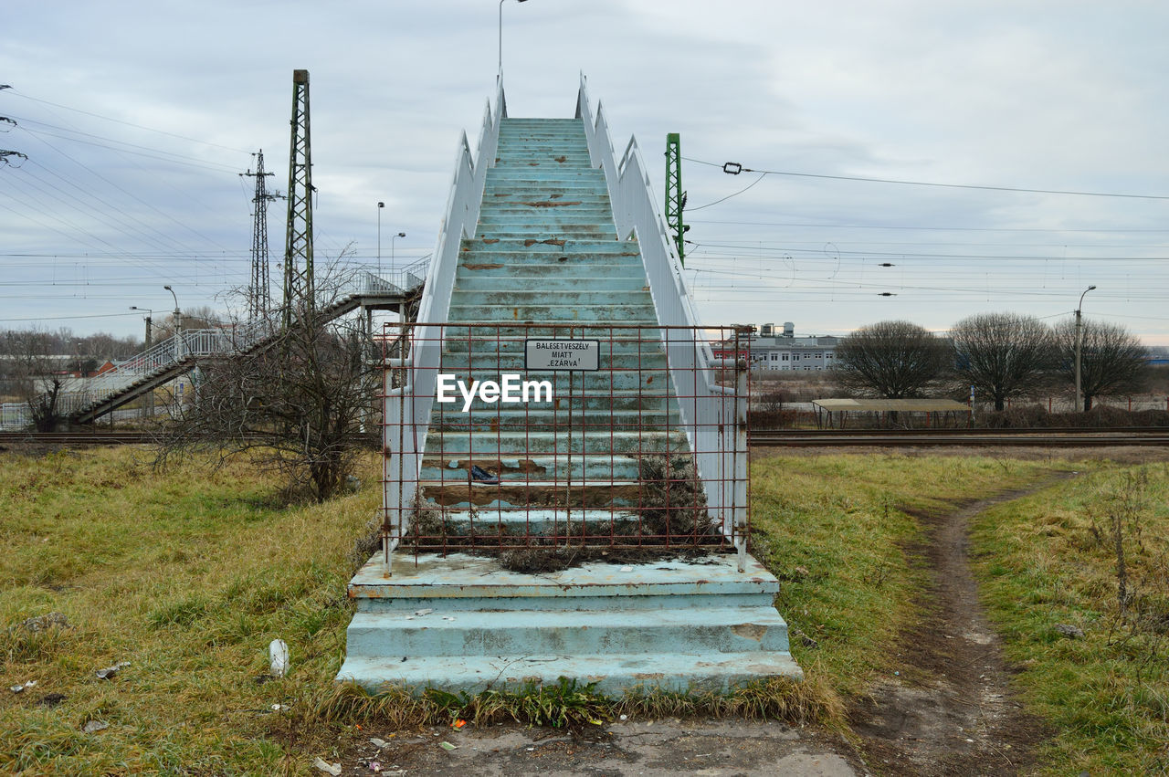 Built structure on field against sky