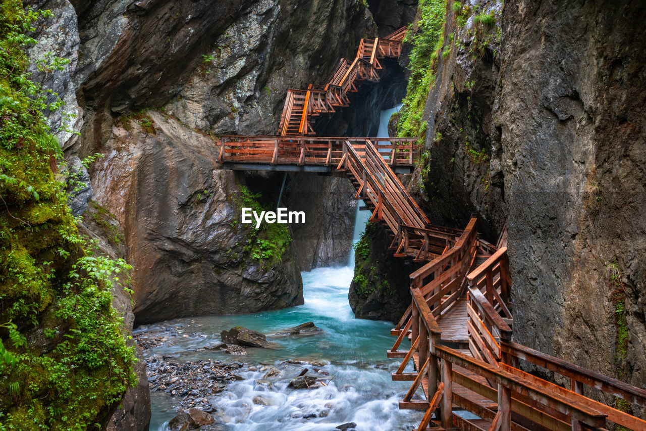 high angle view of bridge over waterfall