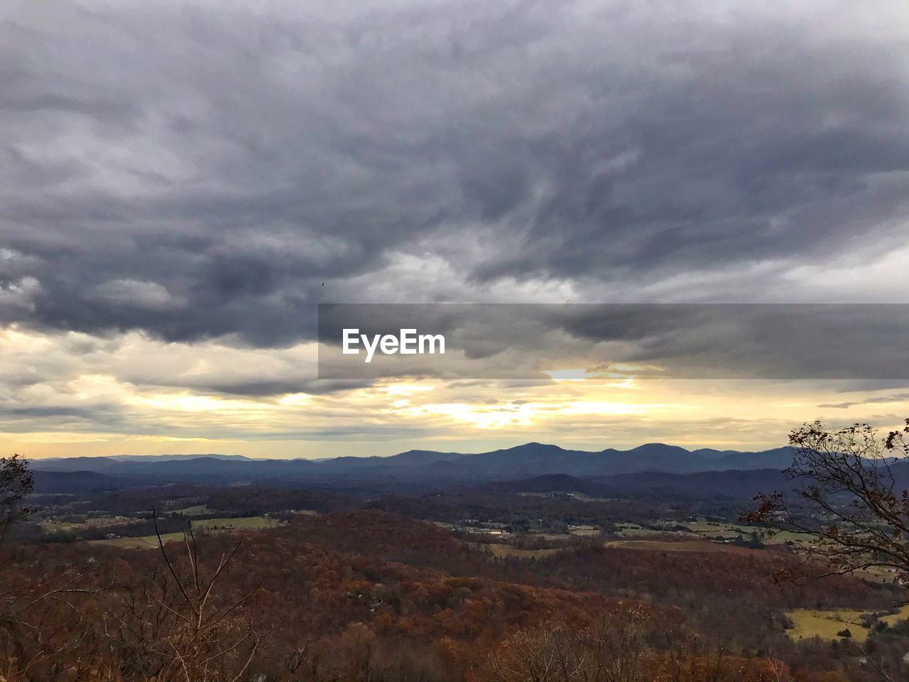 Scenic view of landscape against sky during sunset