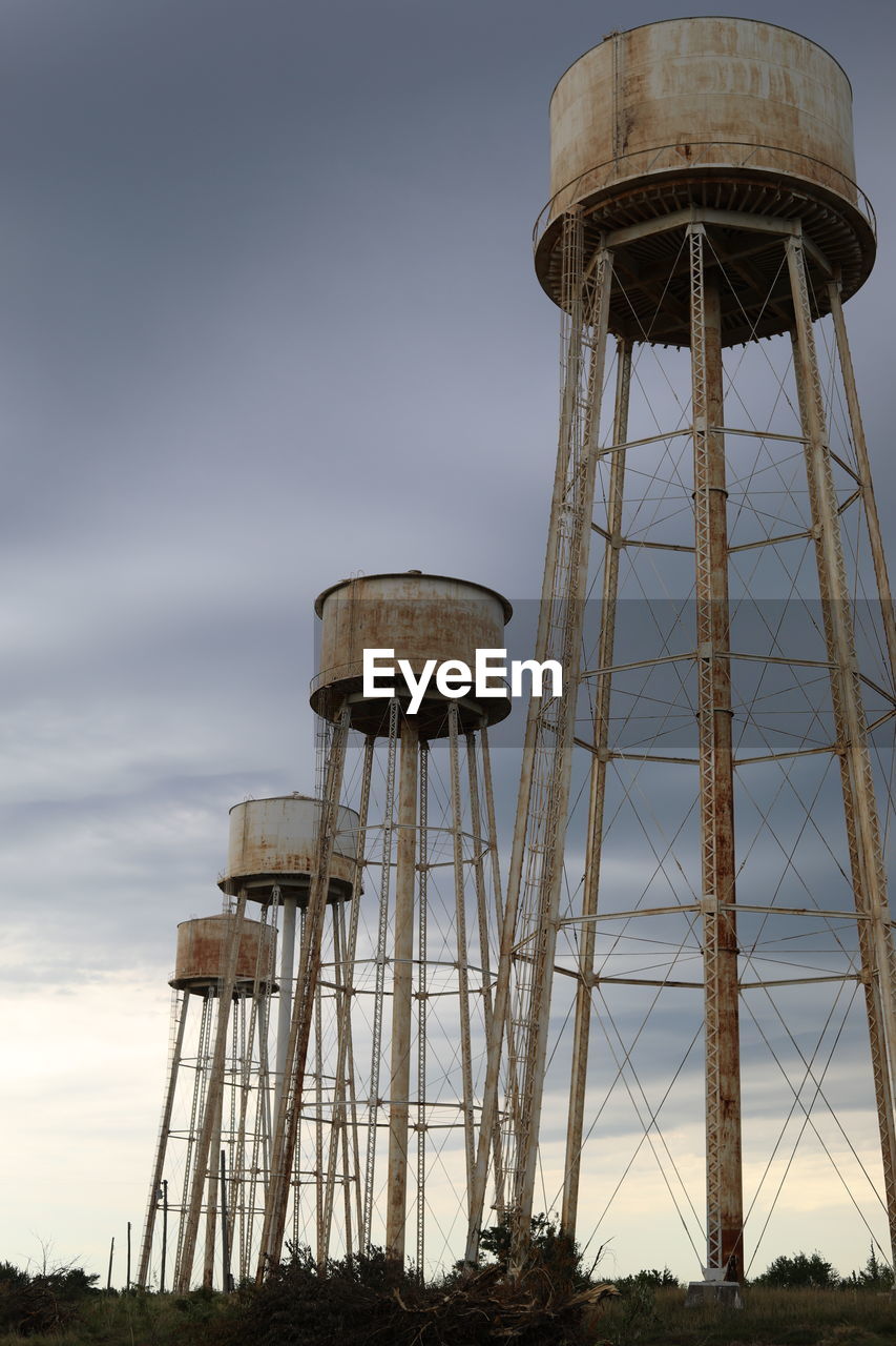 Water towers at the sunflower ammunition plant with a storm rolling in