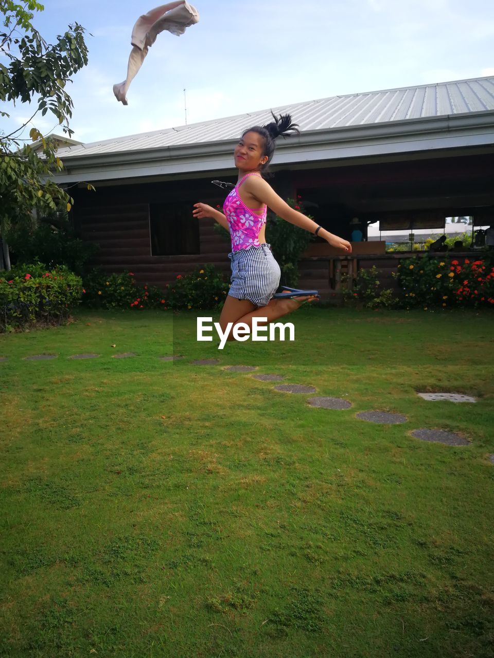 GIRL JUMPING IN FIELD