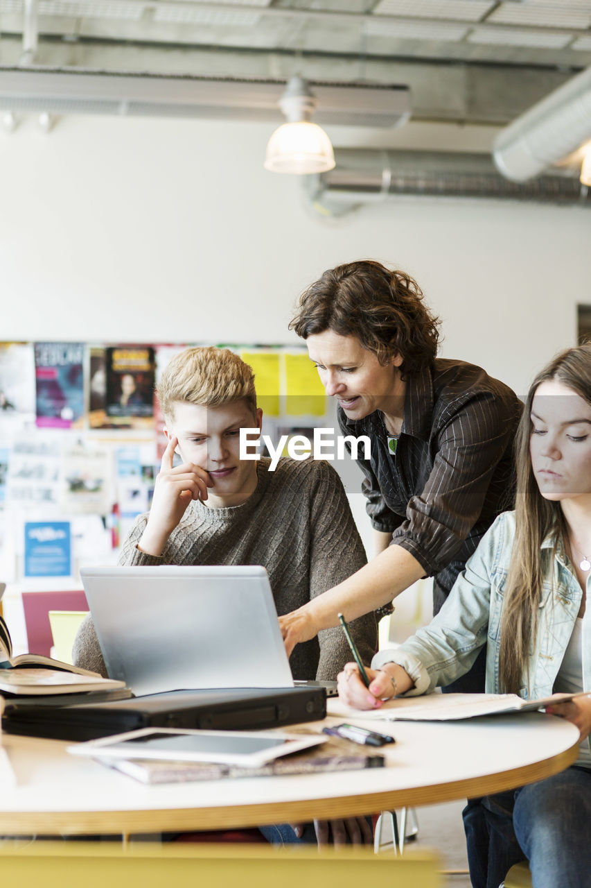 Professor teaching students in classroom