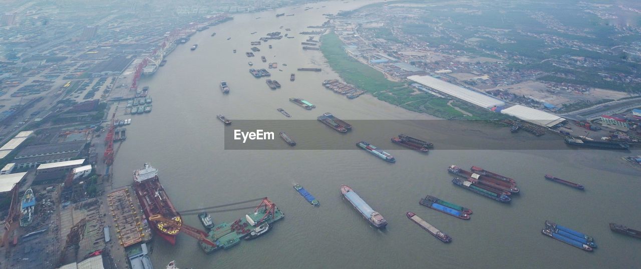 High angle view of cityscape by sea