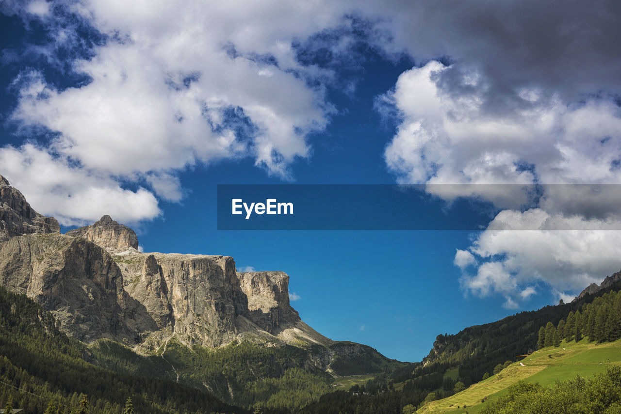 Scenic view of rocky mountains against sky at alto adige