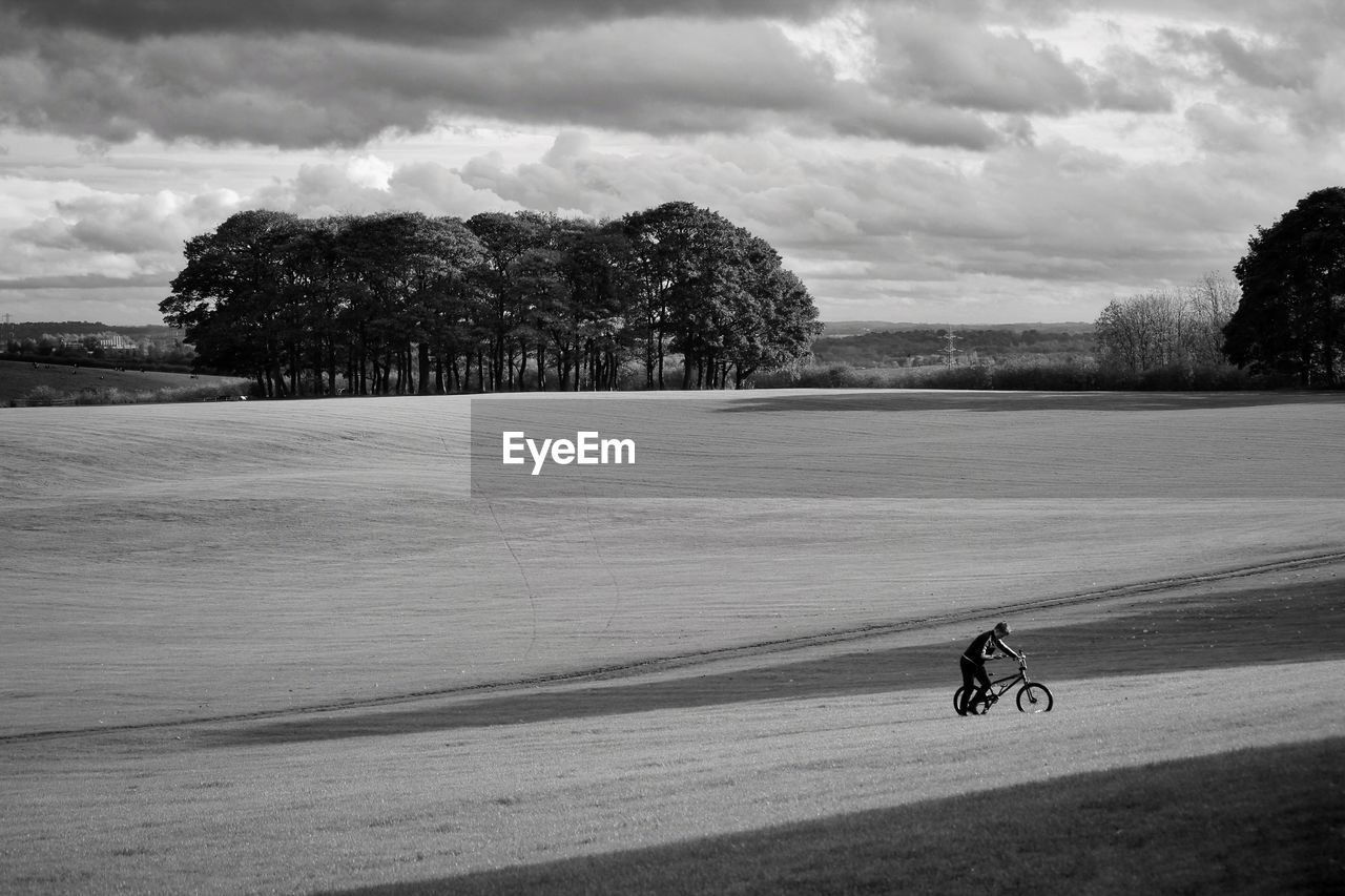 Man riding bicycle on mountain