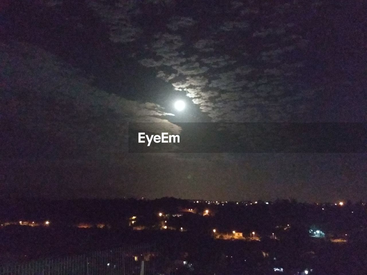 LOW ANGLE VIEW OF ILLUMINATED MOON AT NIGHT