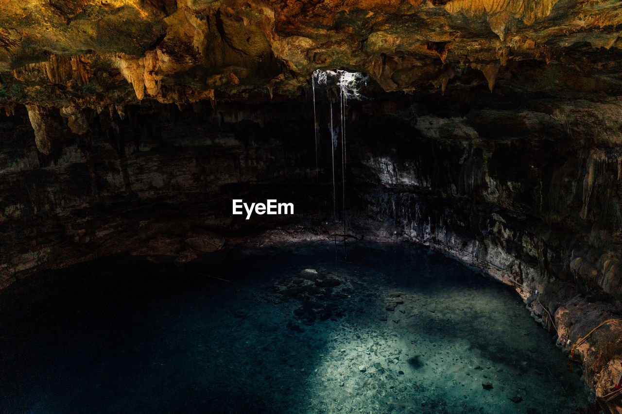 water, rock, cave, nature, rock formation, beauty in nature, no people, geology, formation, scenics - nature, environment, travel destinations, non-urban scene, land, sea cave, outdoors, travel, physical geography, caving, waterfall, tranquility, landscape