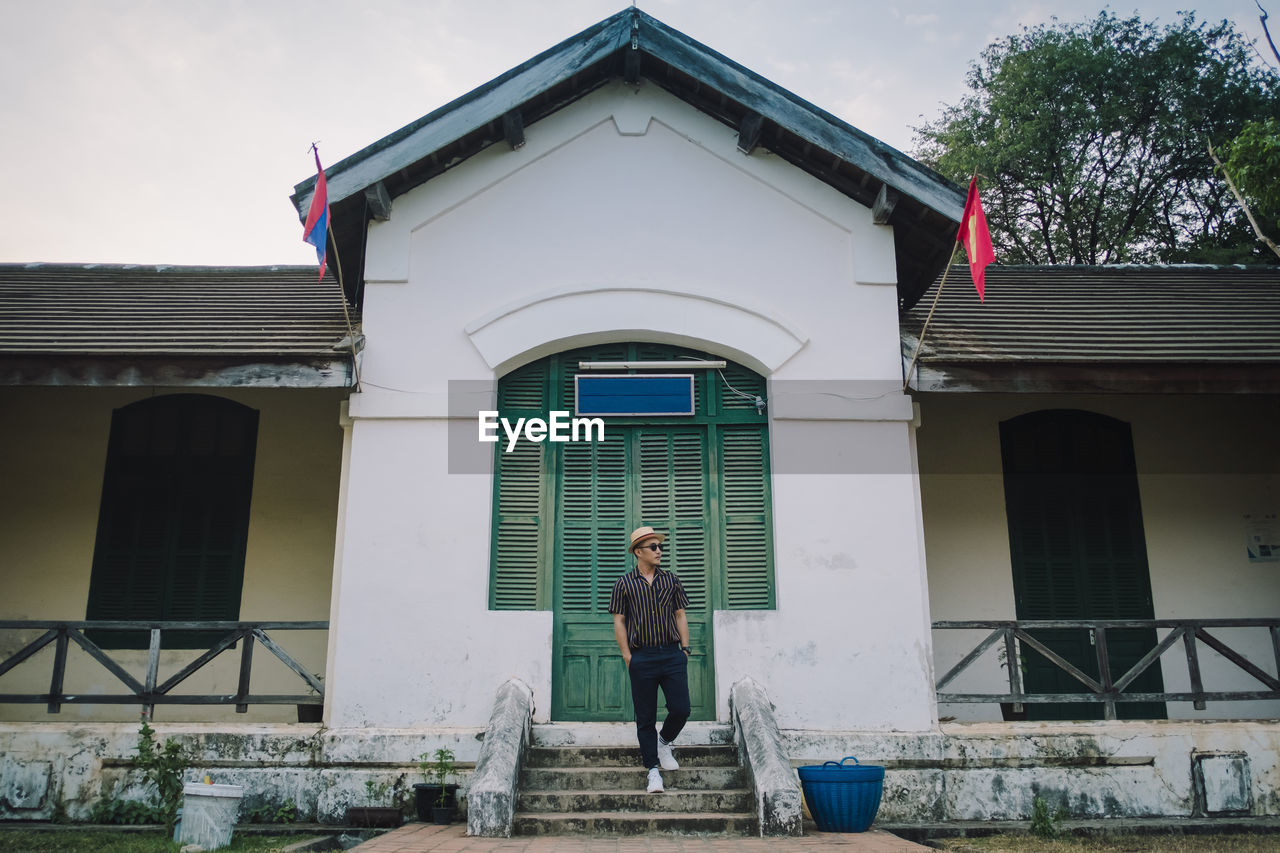 Man standing outside building