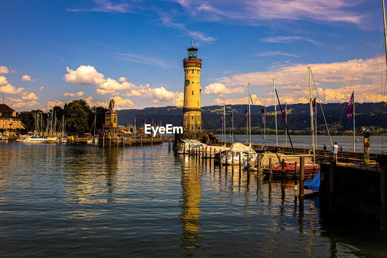 RIVER BY BUILDING AGAINST SKY