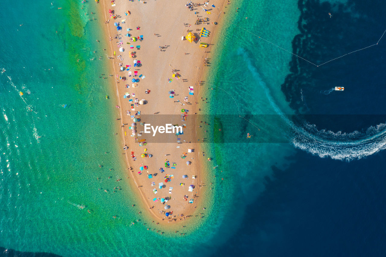 Aerial scene of zlatni rat beach on brac island, croatia