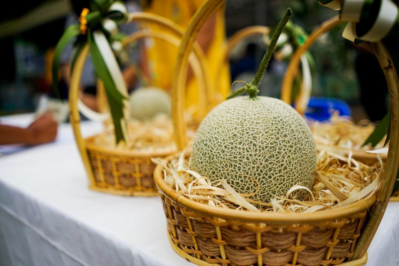 Close-up of fruits in basket on table