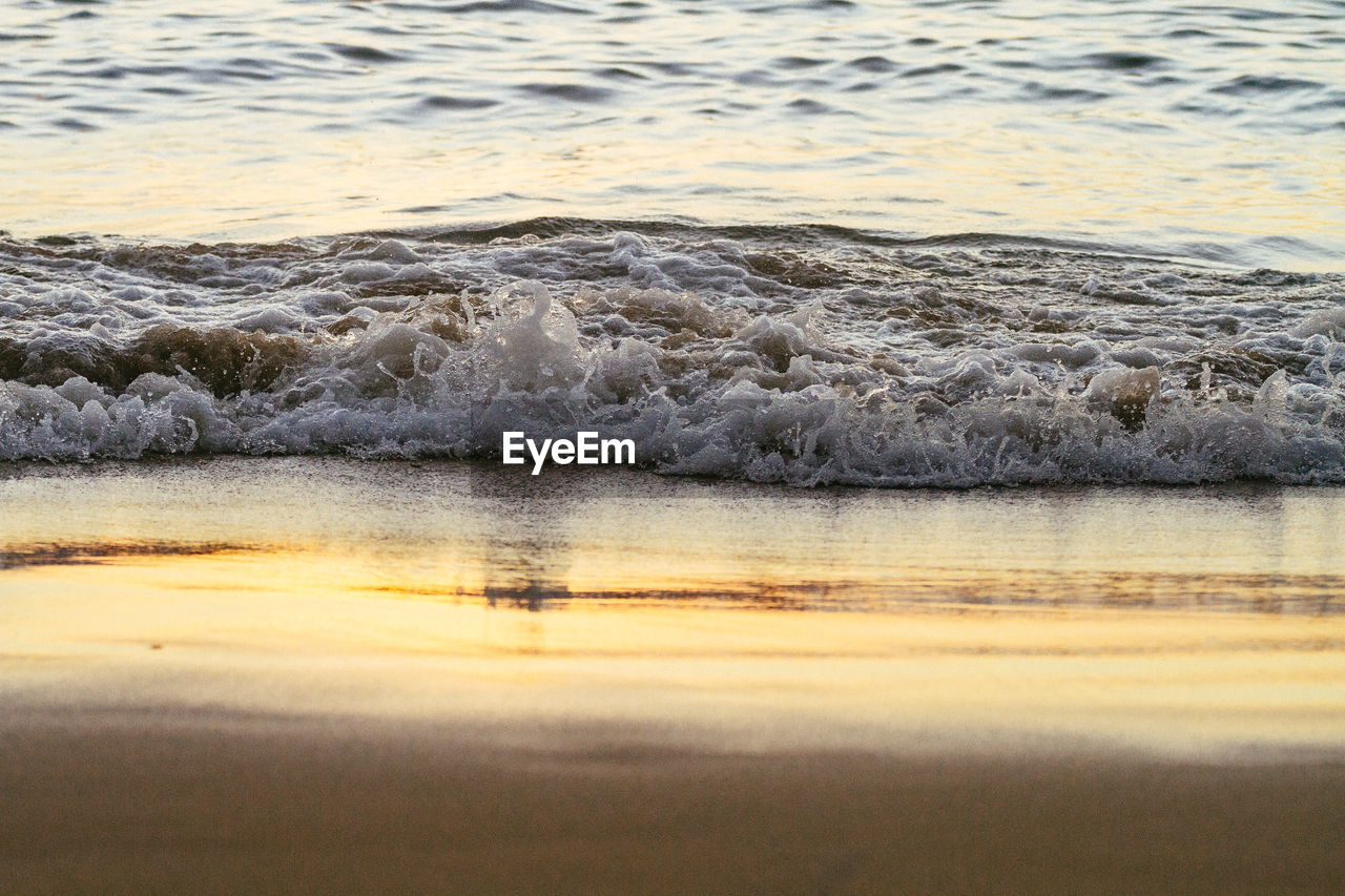 Scenic view of sea against sky at sunset