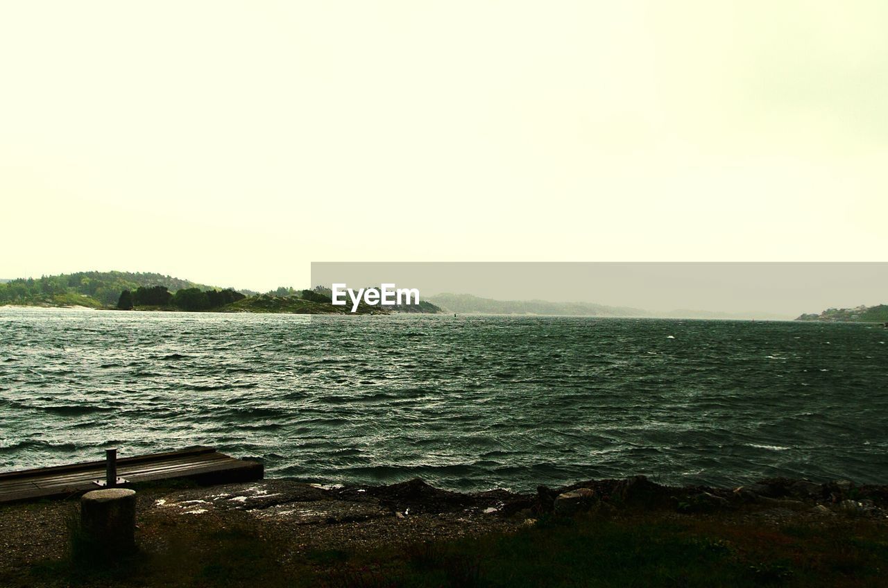 View of calm sea against clear sky