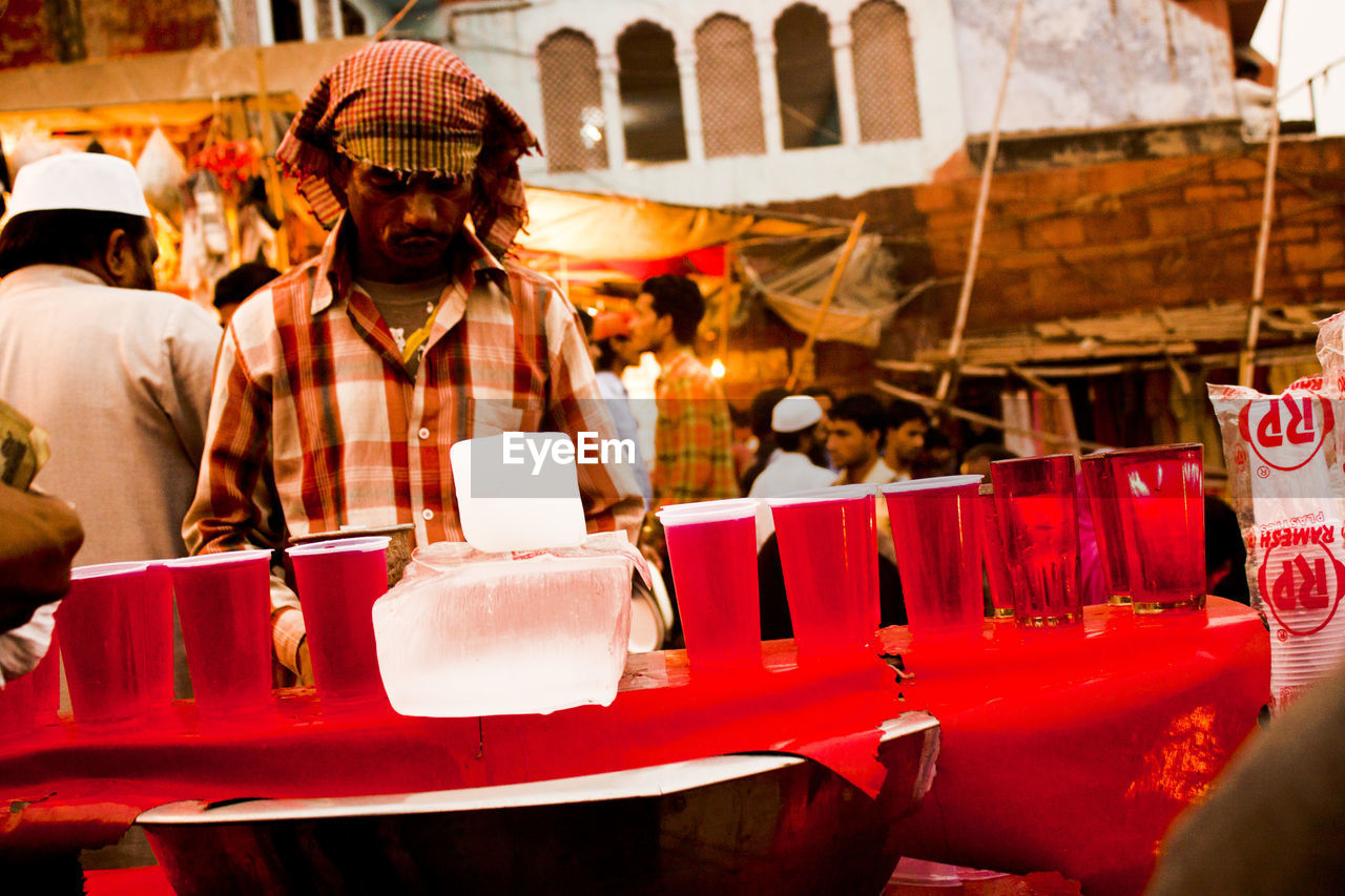 Vendor selling soft drinks in market