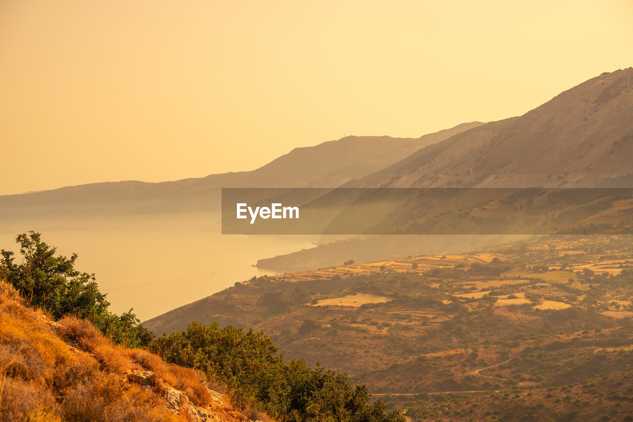 SCENIC VIEW OF MOUNTAINS AGAINST CLEAR SKY