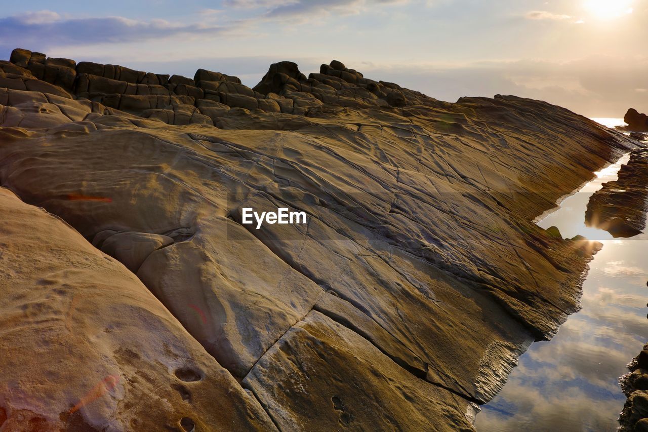 Scenic view of rock formations against sky