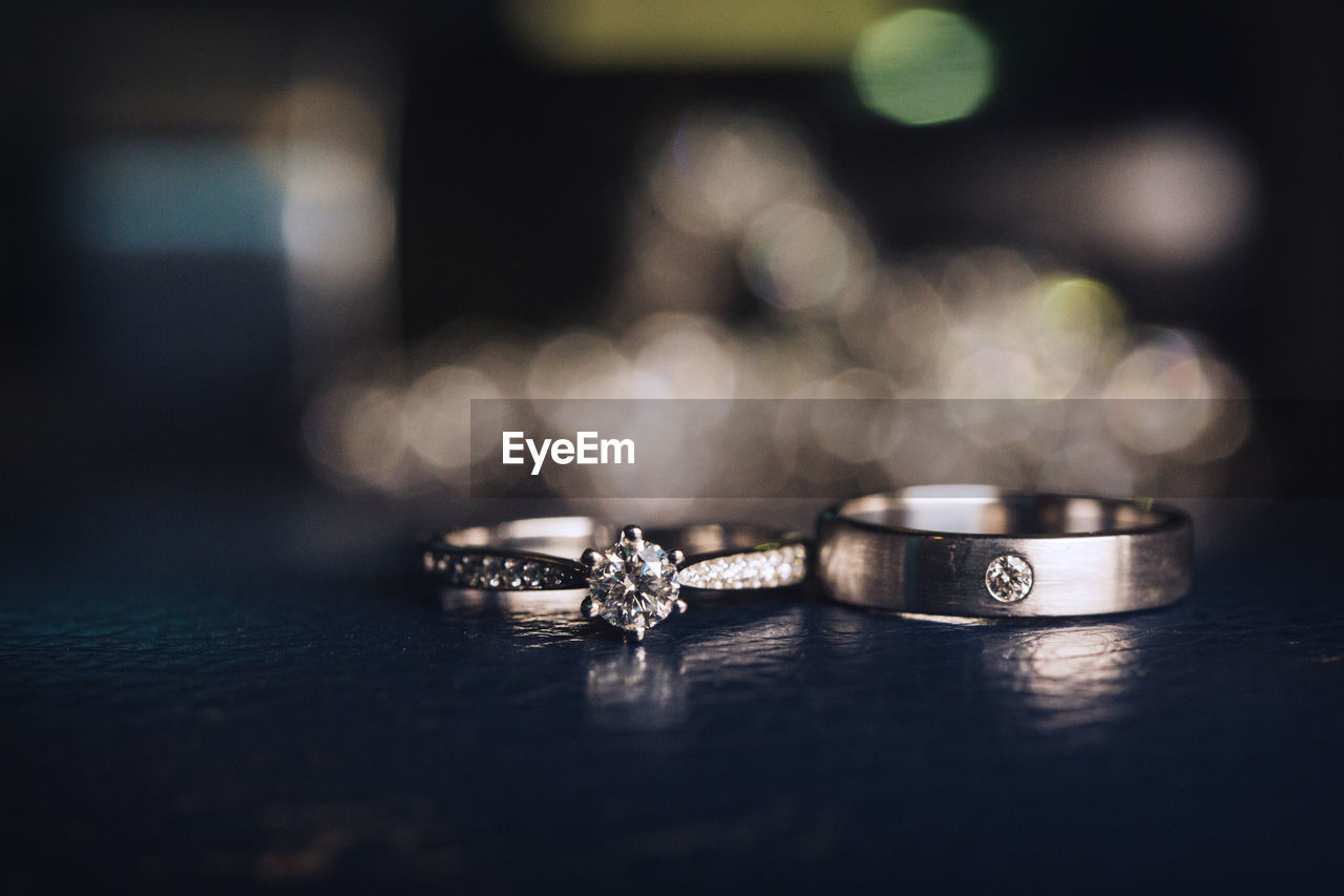 Close-up of wedding rings on table