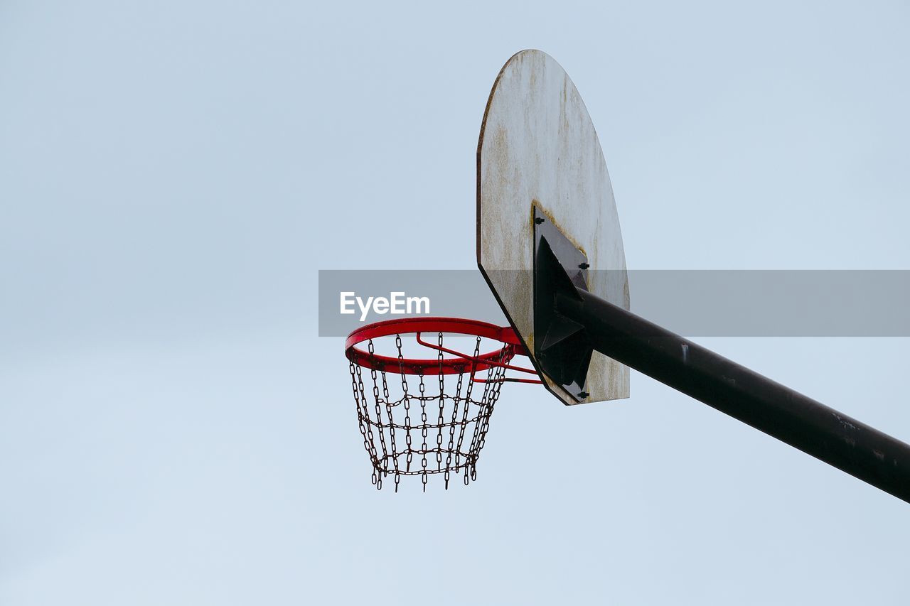 LOW ANGLE VIEW OF BASKETBALL HOOP