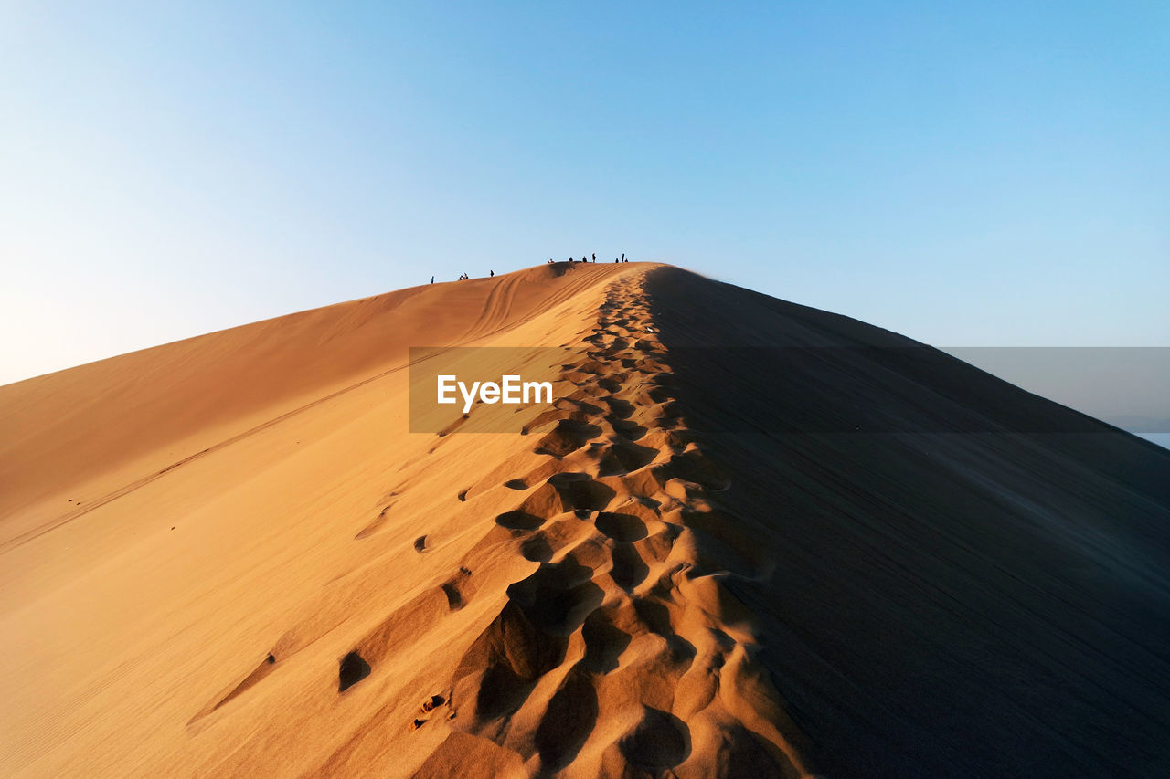 Scenic view of desert against clear sky