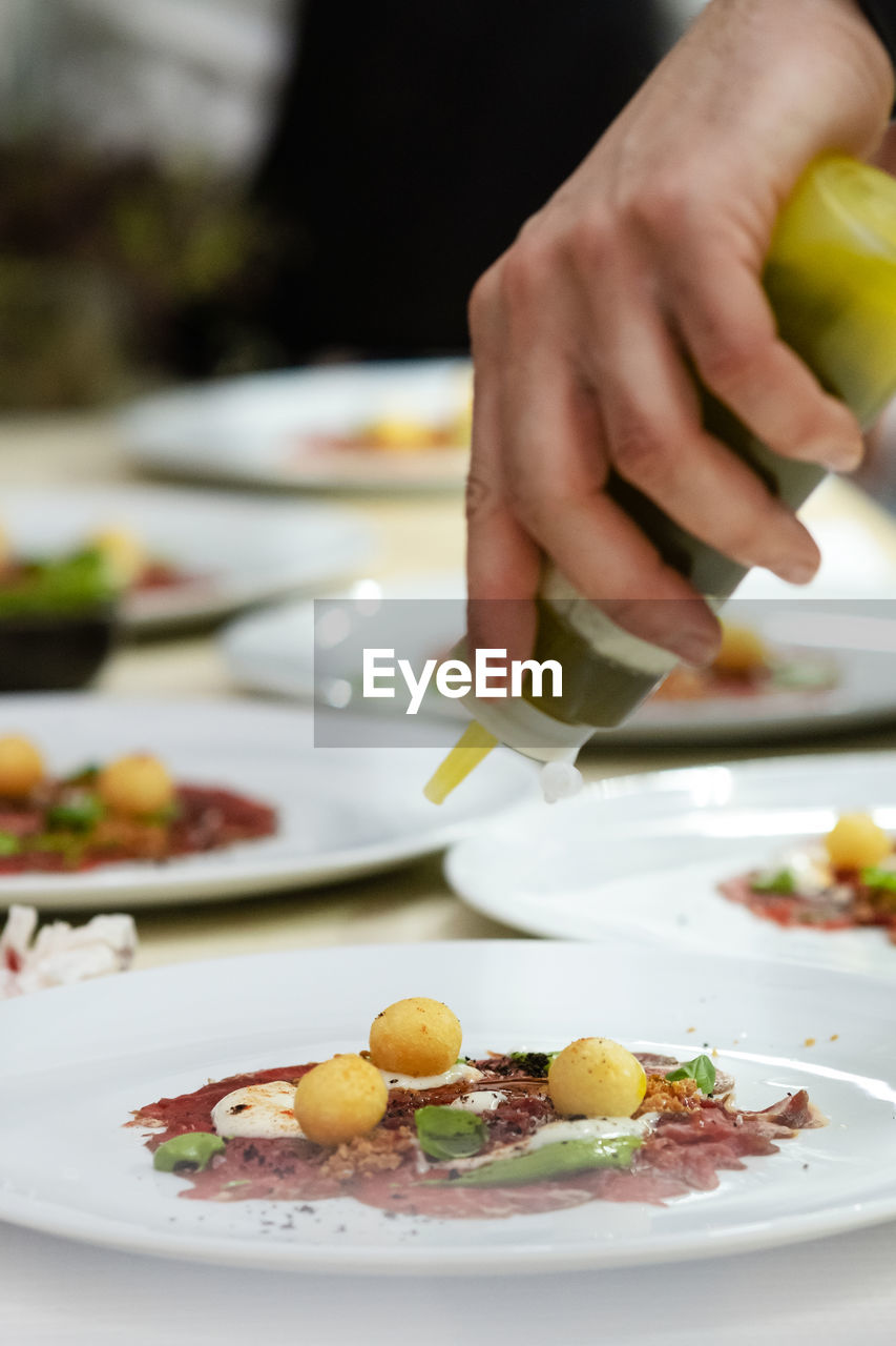 Midsection of man preparing food