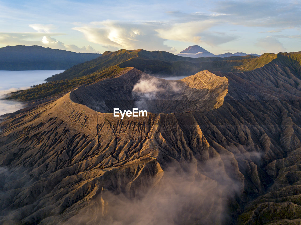Smoke emitting from volcanic mountain at bromo tengger semeru national park, east java, indonesia
