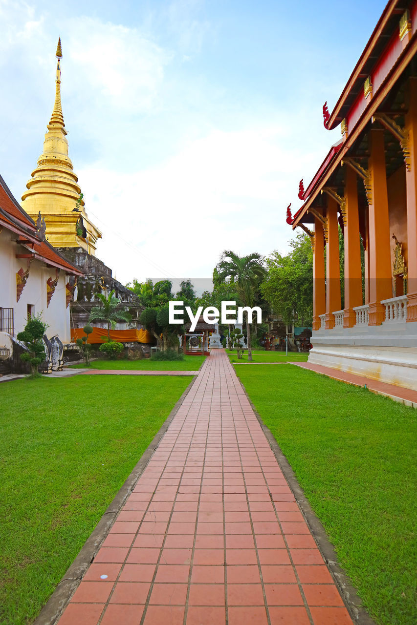 architecture, religion, temple - building, built structure, belief, travel destinations, building, travel, sky, spirituality, building exterior, tourism, history, nature, pagoda, culture, place of worship, the past, grass, cloud, landscape, environment, plant, ancient, temple, mansion, city, no people, tradition, outdoors, beauty in nature, palace, gold, vacation, trip, holiday, landmark, footpath, tower, arriving, tree, business finance and industry, front or back yard, royalty