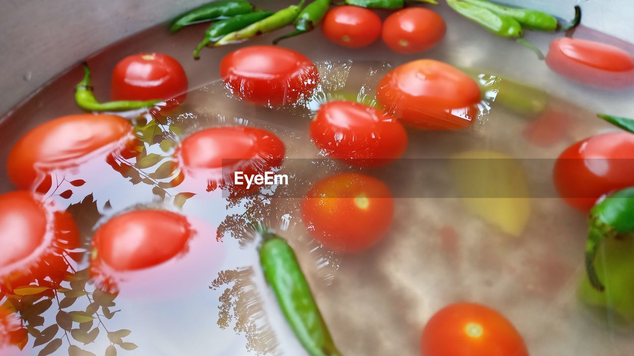 High angle view of cherry tomatoes in container