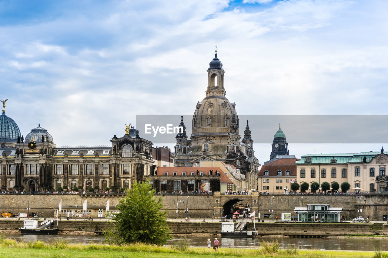 Historic buildings in city against sky