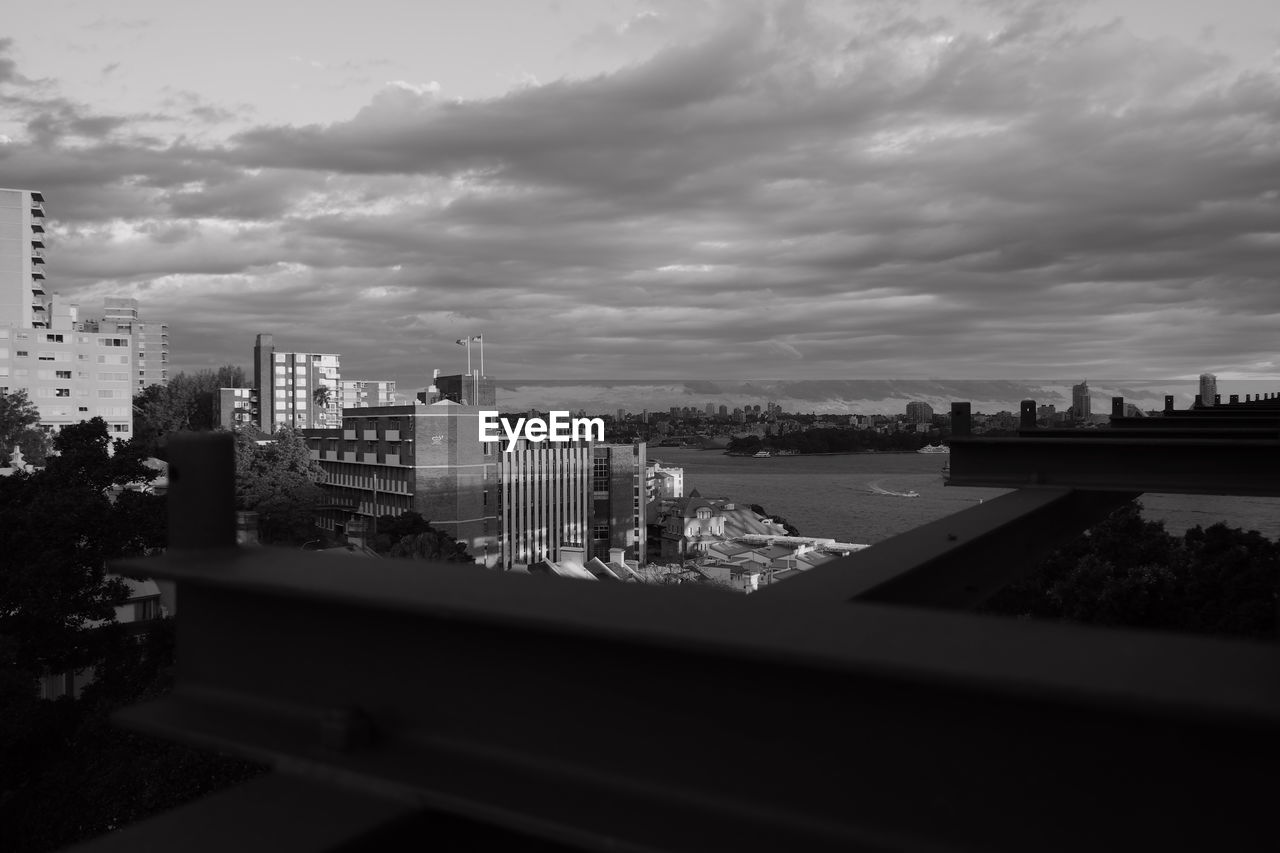 HIGH ANGLE VIEW OF BUILDINGS AND CITY AGAINST SKY