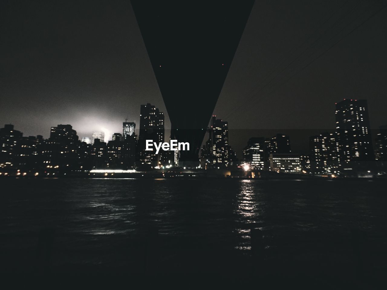 ILLUMINATED CITYSCAPE AT NIGHT