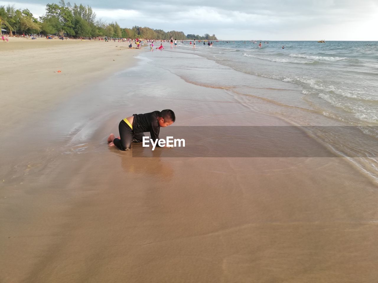 MEN ON BEACH