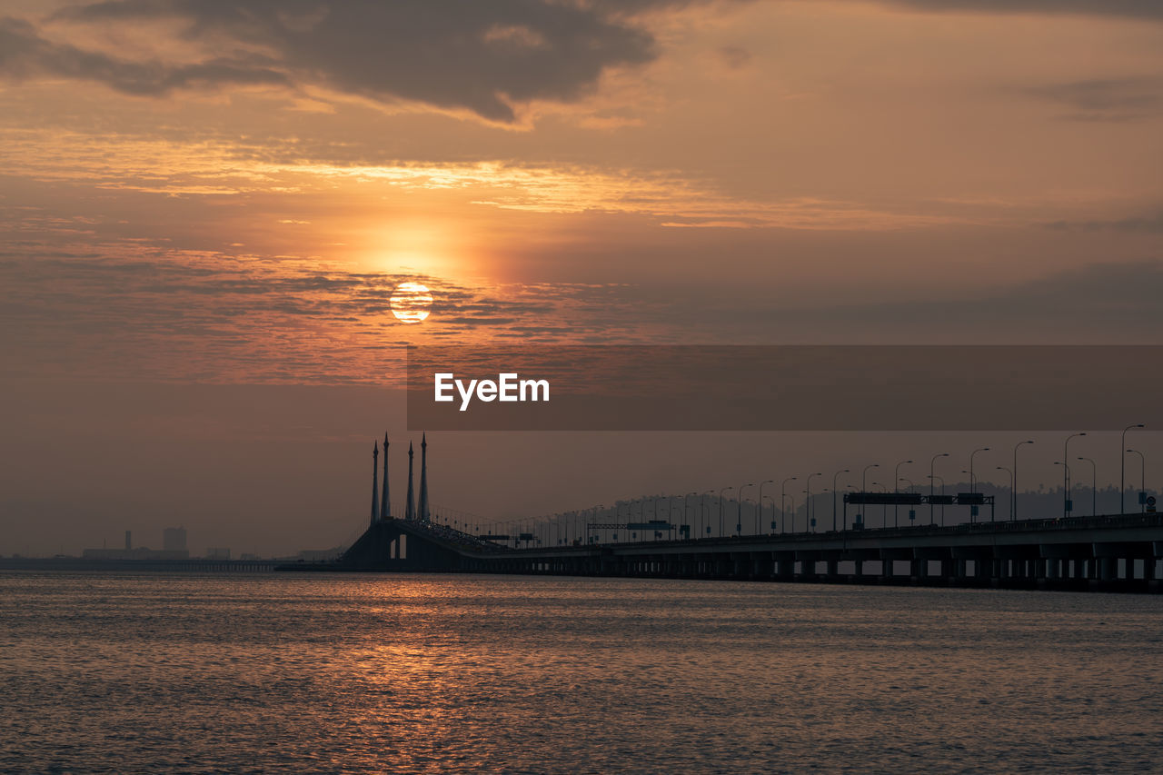 scenic view of sea against orange sky