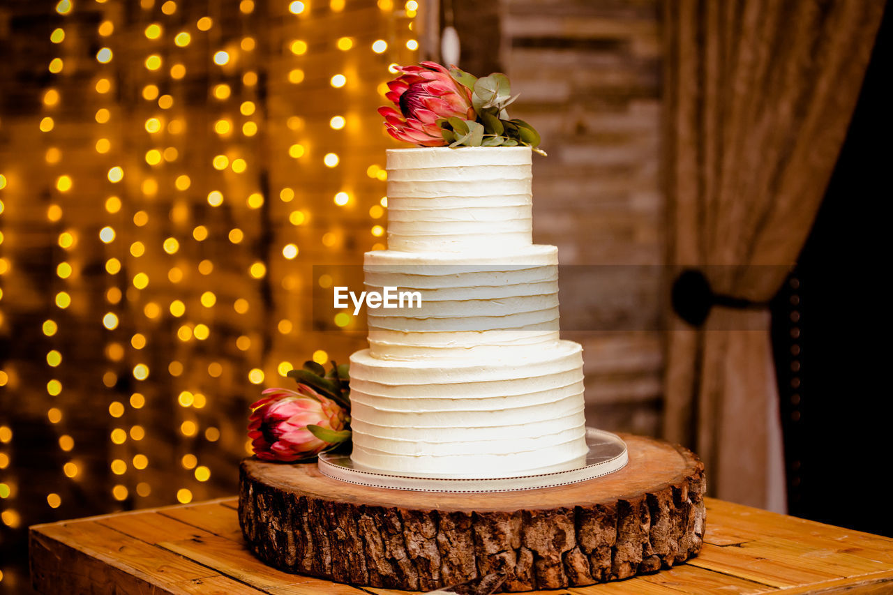 Wedding cake with 3 different sizes layered above each other.  