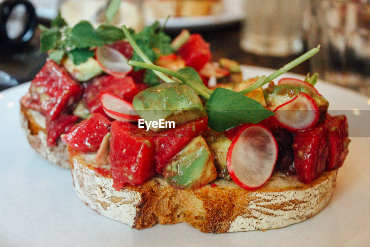 Close-up of open faced sandwich in plate