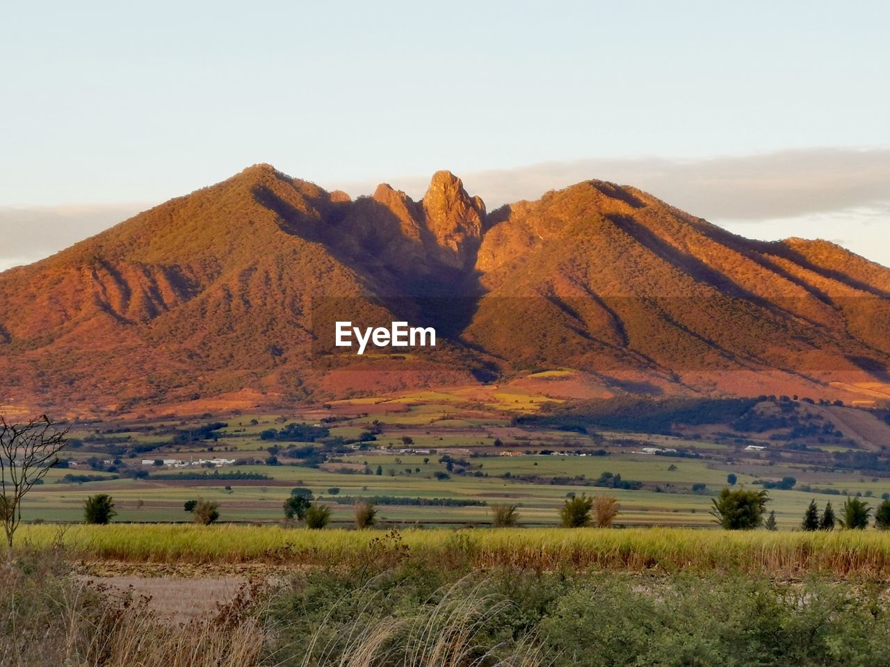 Scenic view of landscape and mountains against sky