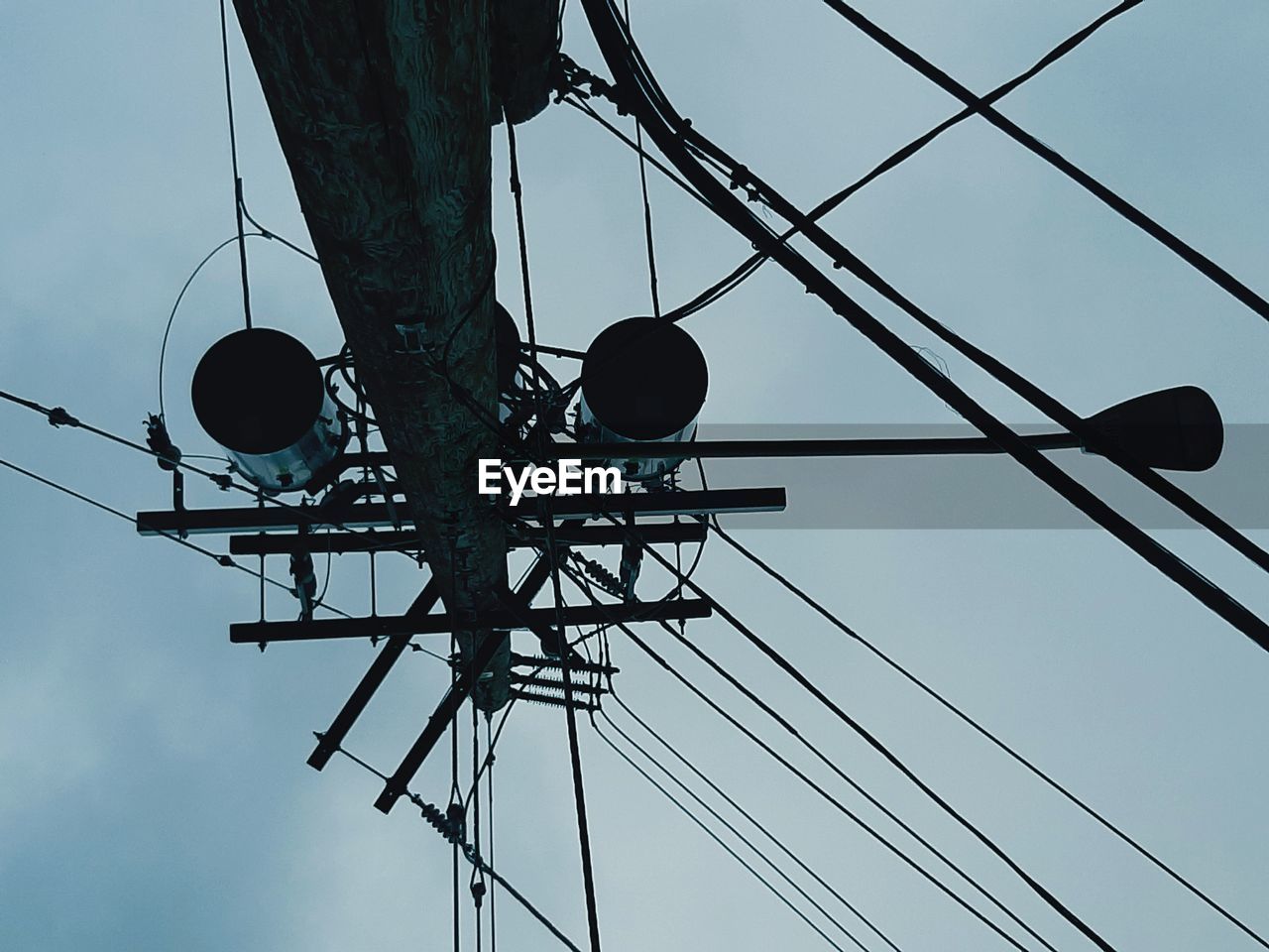 LOW ANGLE VIEW OF POWER LINES AGAINST SKY