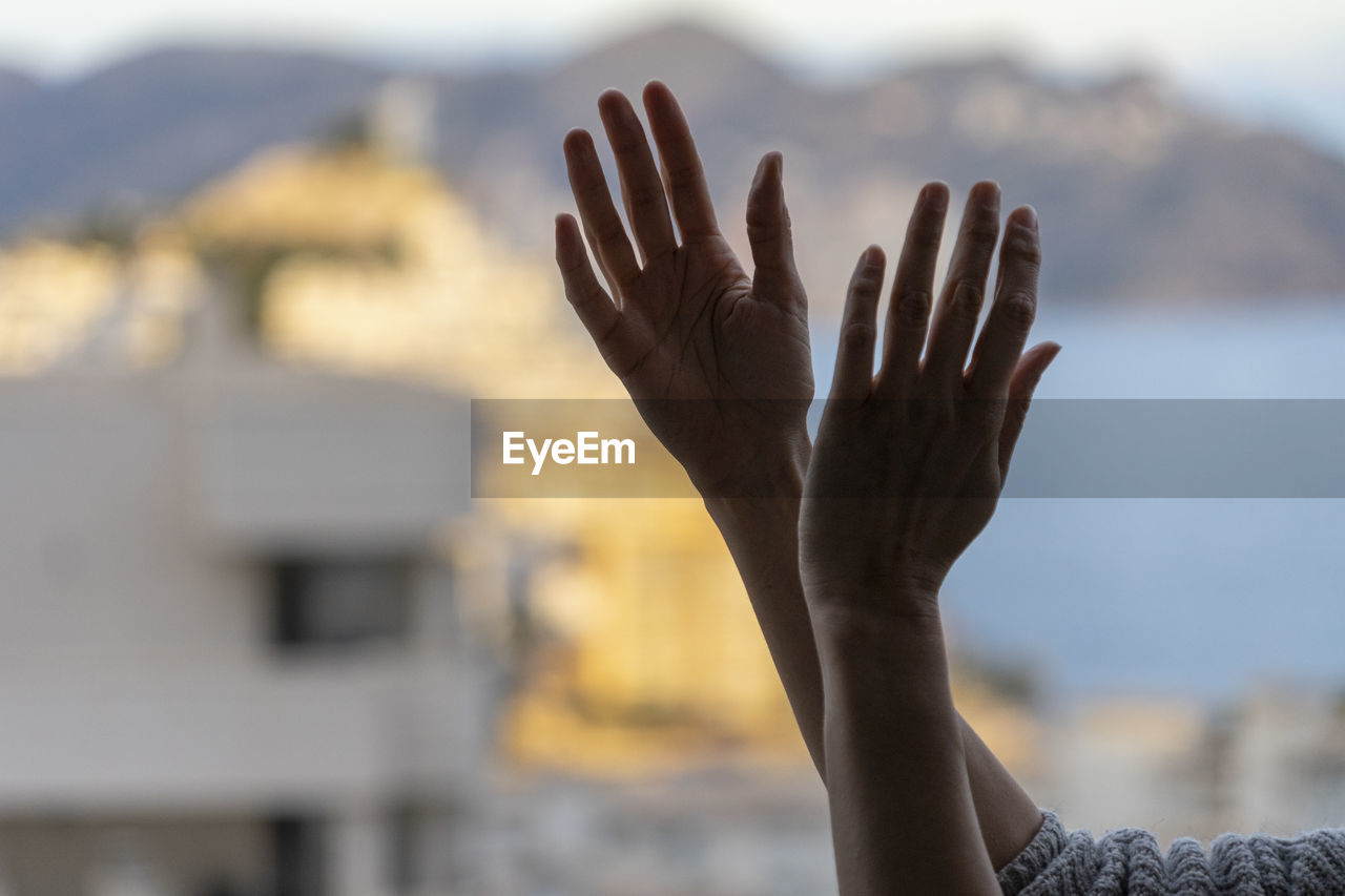 Close-up of hand against blurred background