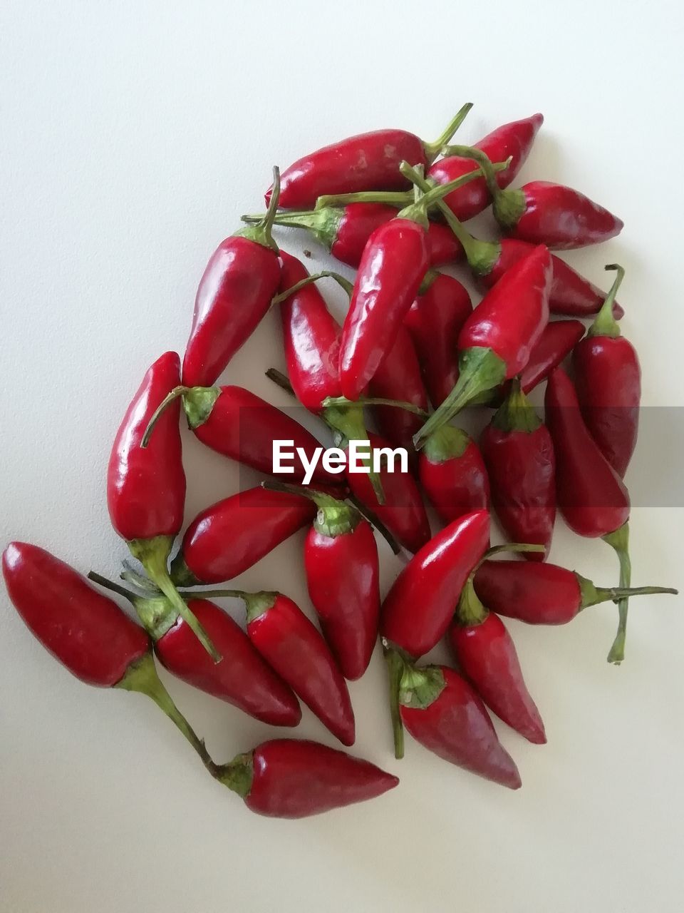 CLOSE-UP OF RED CHILI PEPPERS IN PLATE
