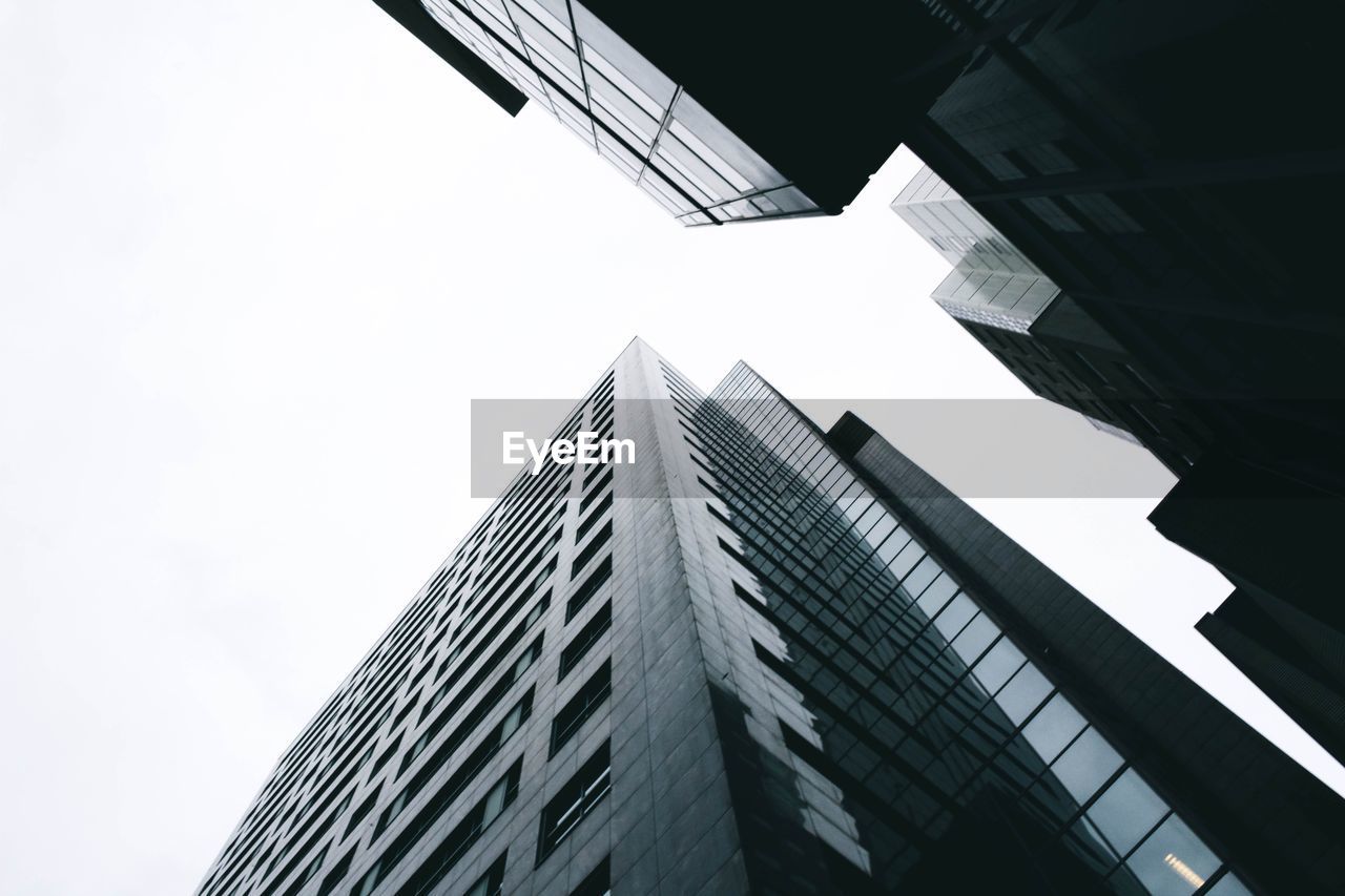 Low angle view of modern buildings against clear sky