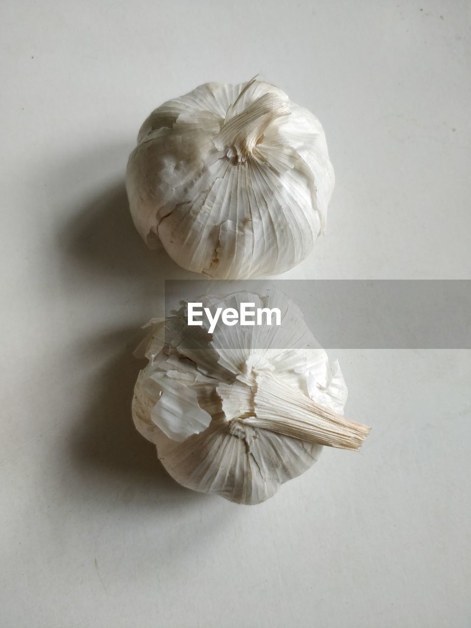 HIGH ANGLE VIEW OF COCONUT ON WHITE TABLE