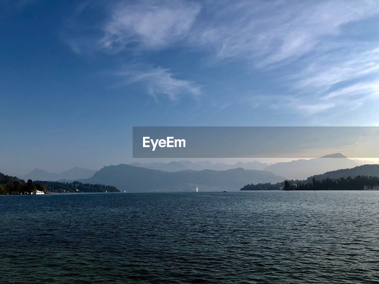 Scenic view of sea against blue sky