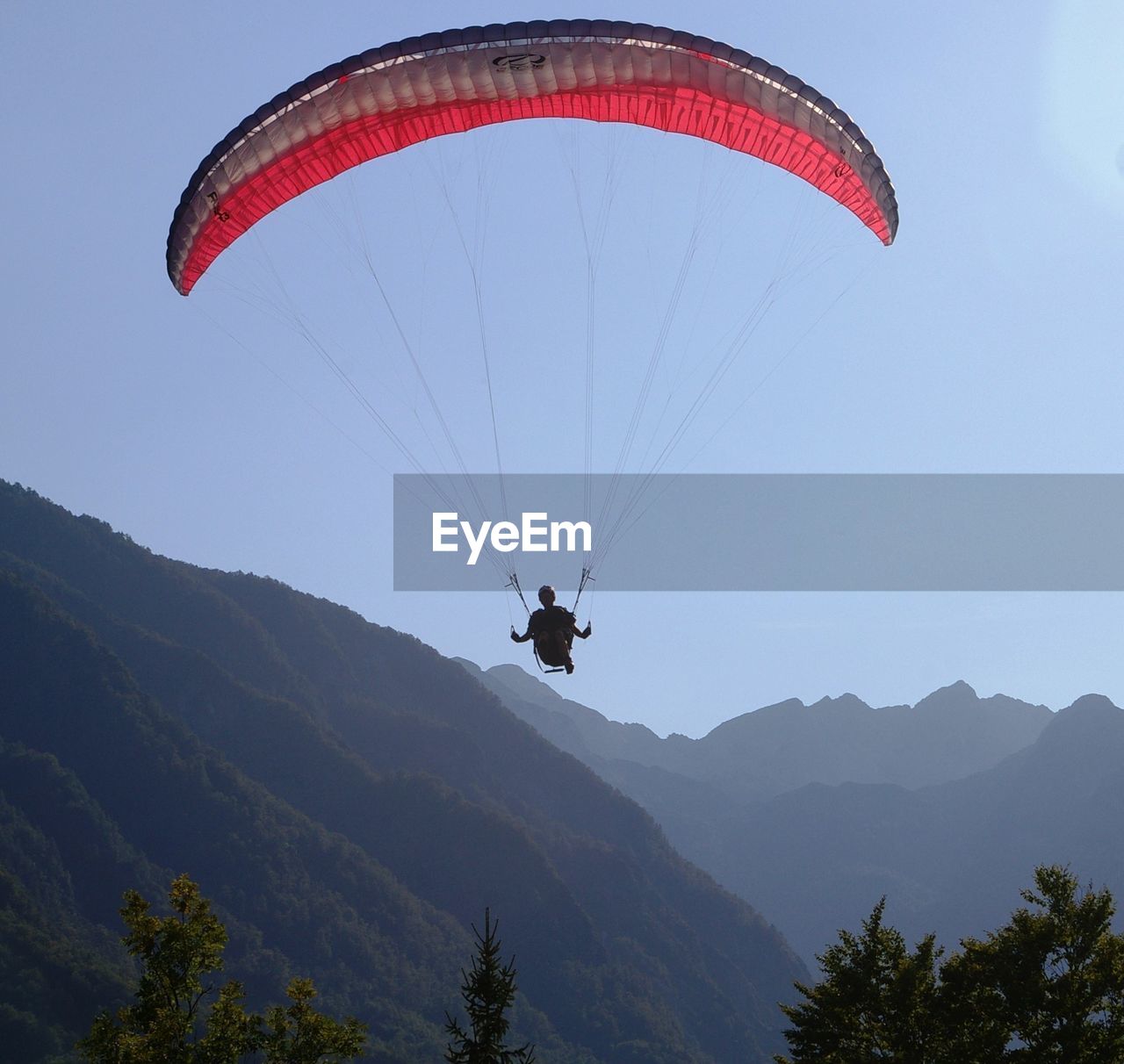 Low angle view of paraglider